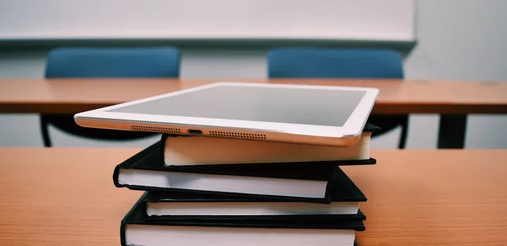 iPad and books on a desk
