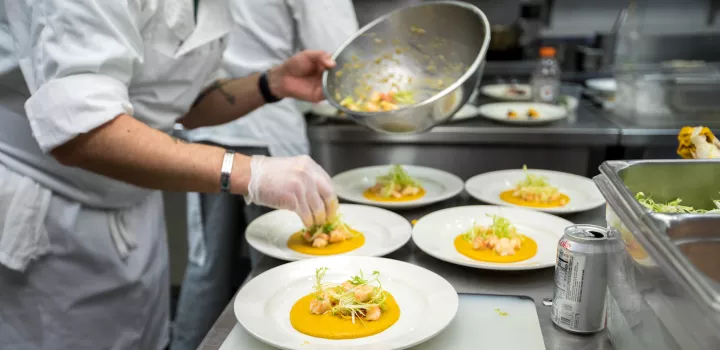 chef plating dishes in a restaurant