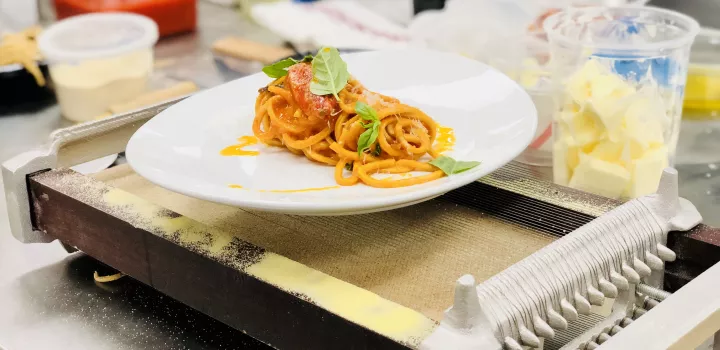 Chef Bruce Kalman's Spaghetti alla Chitarra plate is presented after a demo at ICE LA.