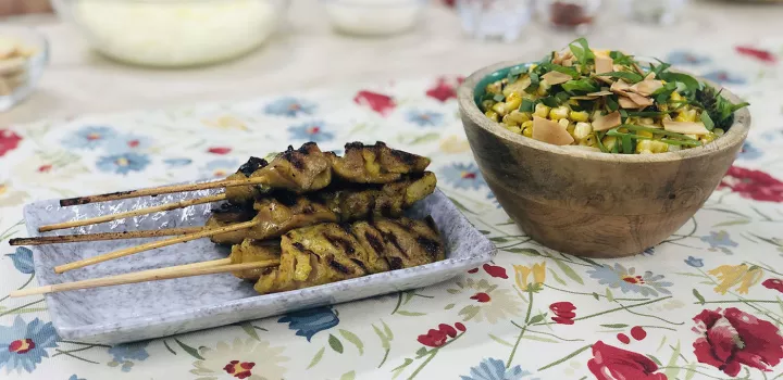 Bangkok barbecue chicken skewers and red curry street corn