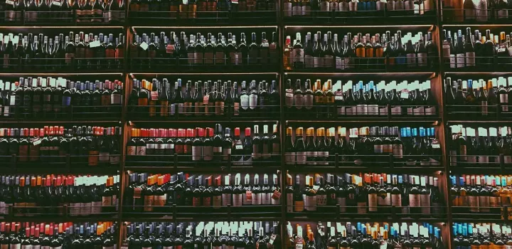 Hundreds of wine bottles line shelves
