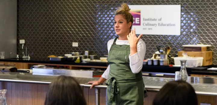 Chef Ana Ros hosts an Elite Chef demo at the Institute of Culinary Education.