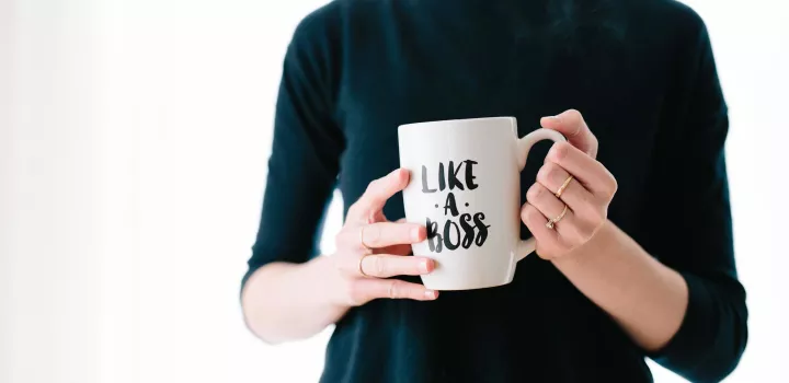 Manage your time like a boss - woman holding coffee mug