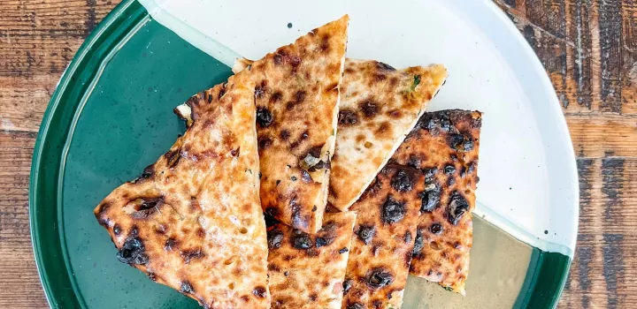 A plate of cheese-stuffed naan.