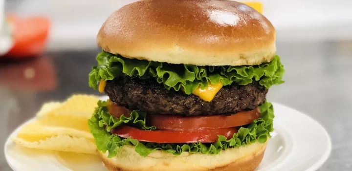 A burger is styled for photography.