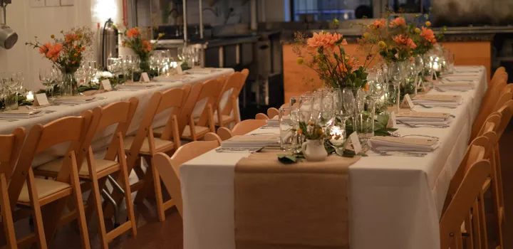 Tables set for a dinner at the Natural Gourmet Institute