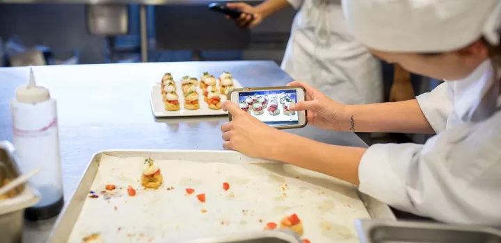 Students photograph food for social media.