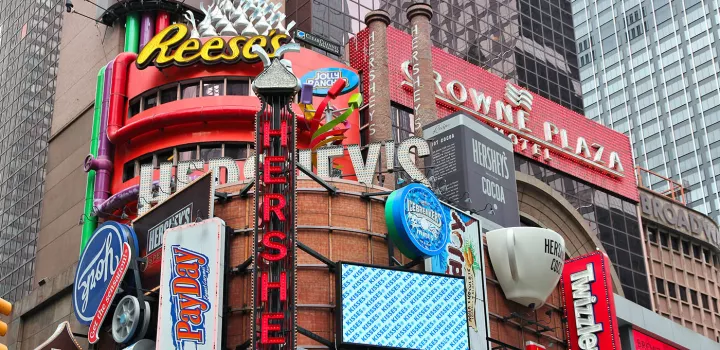The Crowne Plaza Times Square Manahattan is next to Hershey's marquees in NYC.