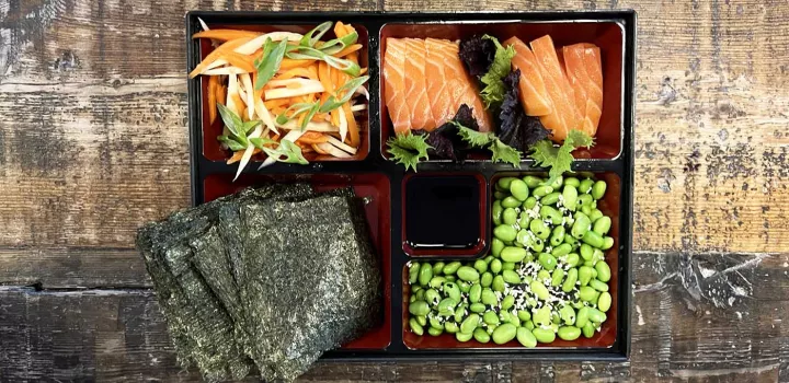 A bento snacking box with sashimi.