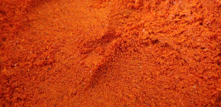 A close up of red paprika powder