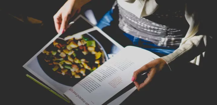 turning the pages of a cookbook