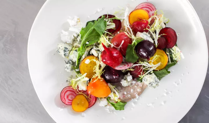 A salad of colorful beets and lettuces