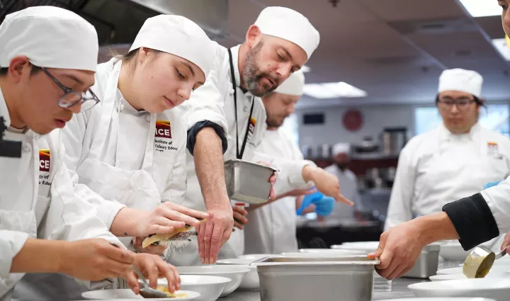 ICE students work together to plate a dish