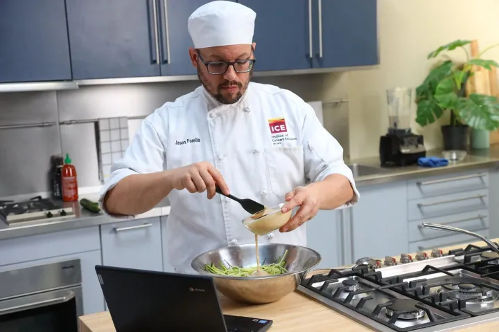 Photo of a laptop featuring the Online Culinary Arts & Food Operations.