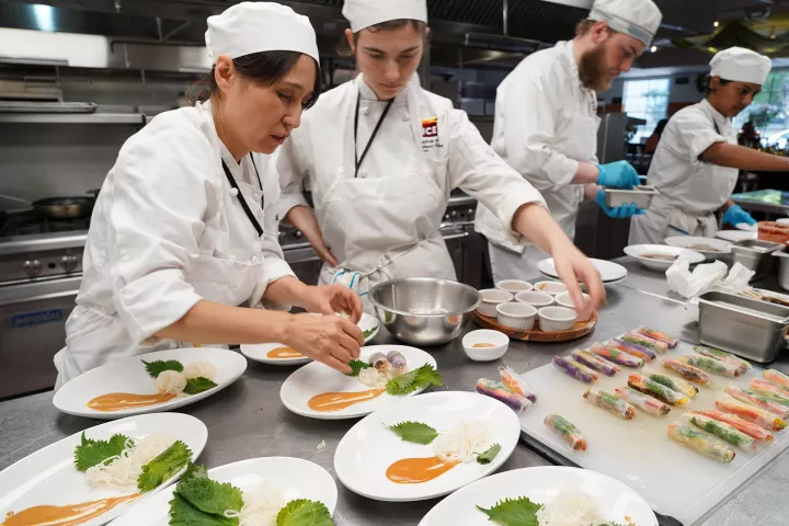 ICE students in the plant based program plating dishes